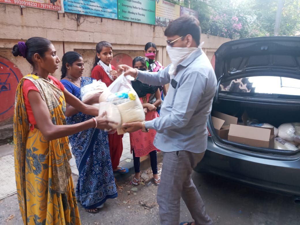 Mohammed Sayeed Shaikh during relief and social service work — photograph 4 of 6